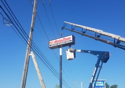 Autozone Illuminated Pylon Sign Installation with a crane and bucket truck in Maryland