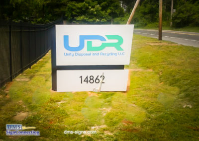 Aluminum Illuminated Quadrilateral Monument sign that reads UDR Unity Disposal and Recycling LLC