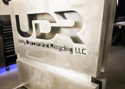 Production stage: Prepped for painting. Illuminated Monument sign that reads UDR Unity Disposal and Recycling LLC