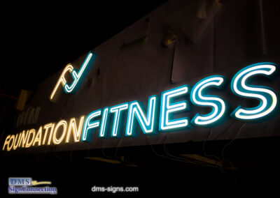 Exposed neon channel letter Foundation Fitness while being tested at DMS signs shop.