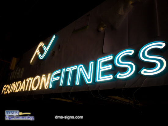 Exposed neon channel letter Foundation Fitness while being tested at DMS signs shop.