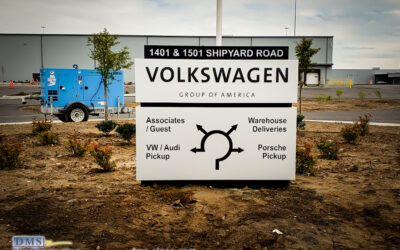 Illuminated architectural sign with directional info designed, manufactured and installed for Volkswagen Group of America